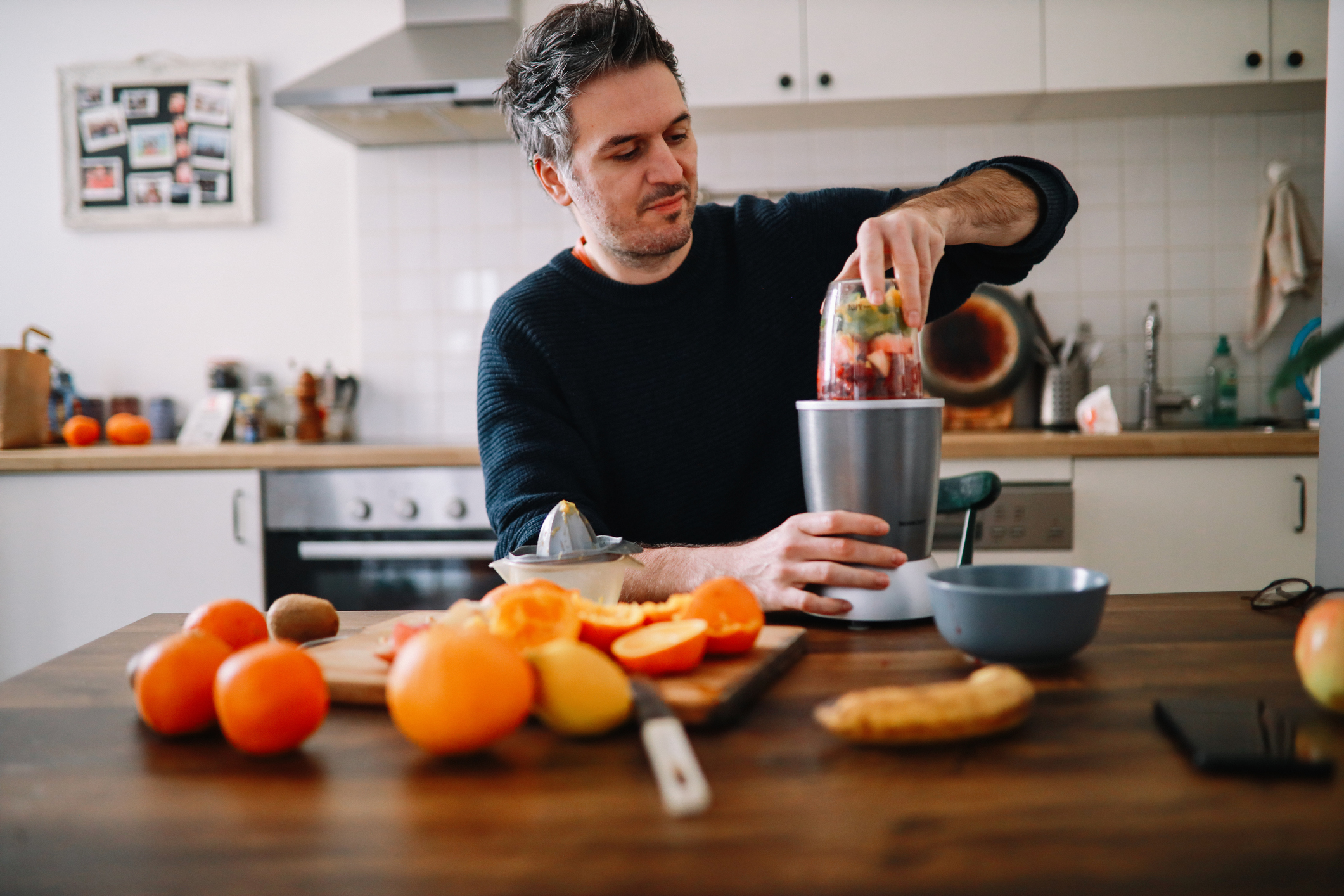 man preparing a smoothie for a healthy meal