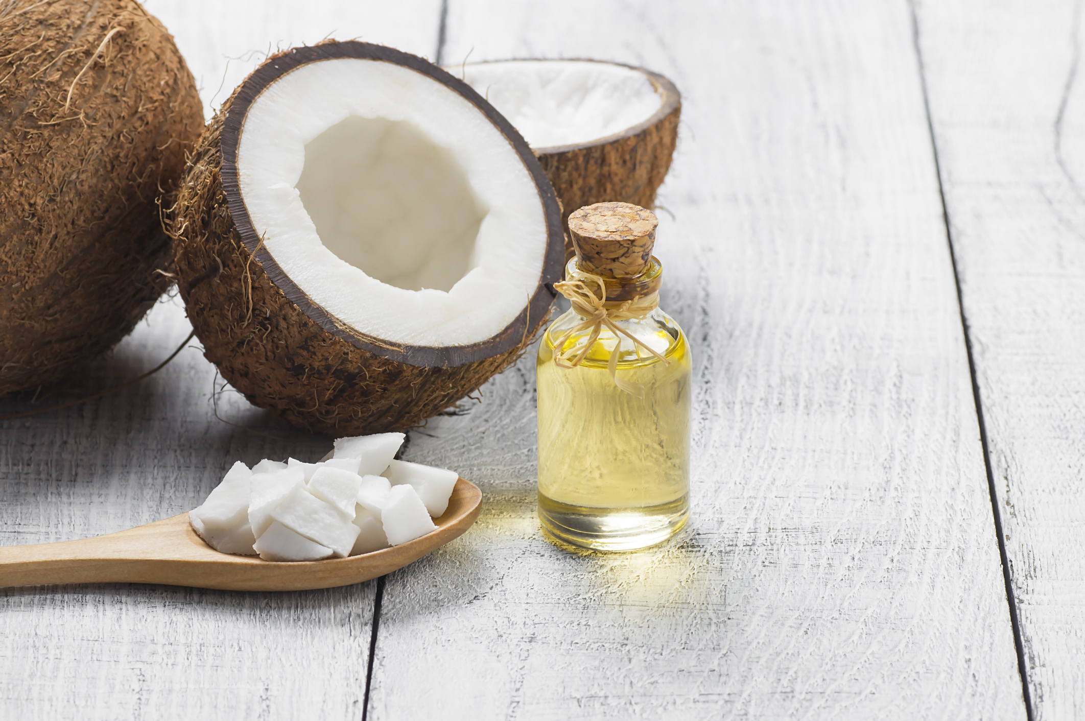coconut oil with fresh coconut in the background